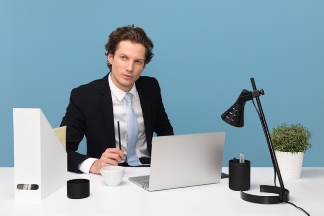 adult-businessman-concentration-1586996